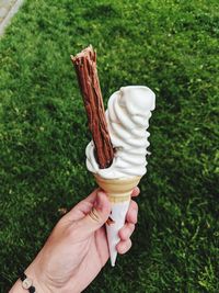 Hand holding ice cream cone