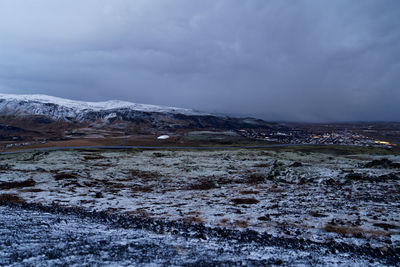 Scenic view of snowcapped mountains against sky