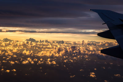 Aerial view of cityscape against sky during sunset