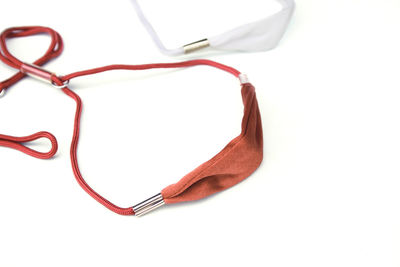 High angle view of eyeglasses on table against white background