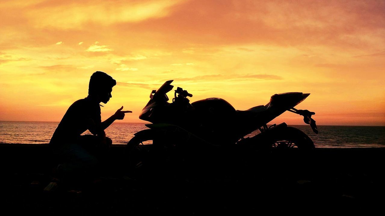 sunset, sea, silhouette, horizon over water, water, sky, beach, lifestyles, leisure activity, beauty in nature, orange color, scenics, men, shore, nature, idyllic, cloud - sky, tranquil scene