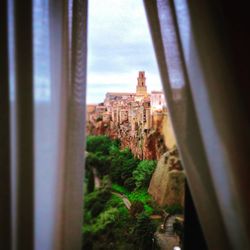 Buildings seen through window