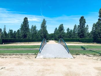 Playground in park against sky