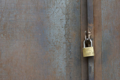 Close-up of padlock on door