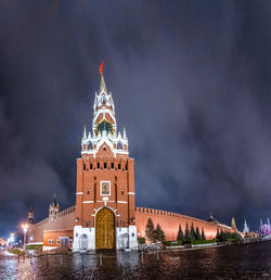 Illuminated building against sky at night