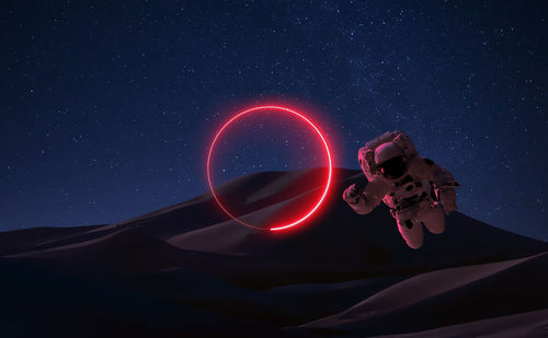 Light painting against sky at night