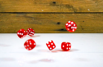 Close-up of red cherries on table