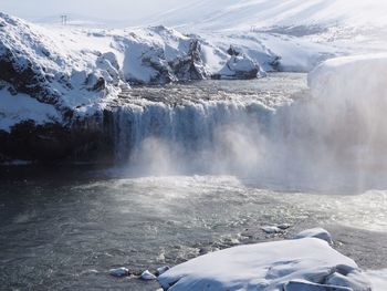 Scenic view of godafoss waterfall during winter