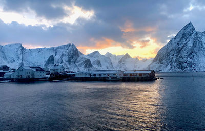 Scenic view of snowcapped mountains against sky during sunset