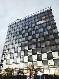 Low angle view of office building against sky