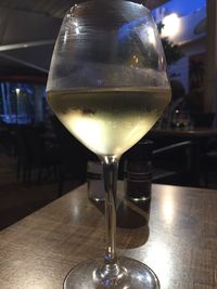 Close-up of wine glasses on table