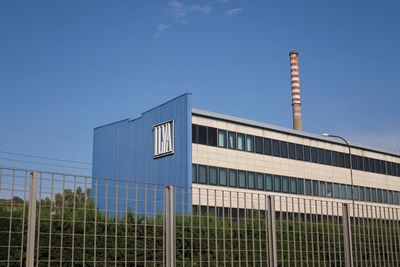 Low angle view of building against clear blue sky