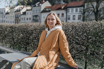 A beautiful young stylish woman walking in the city. spring mood