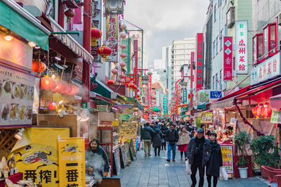 People walking on street in city