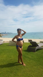  pregnant thai women standing on beach against sky