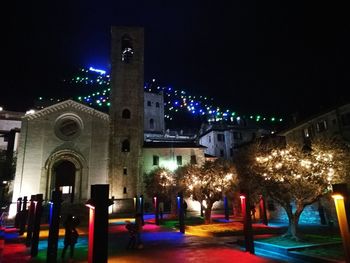 Illuminated buildings in city at night