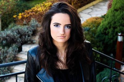 Portrait of beautiful woman wearing black leather jacket