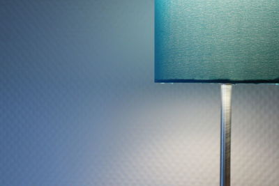 Close-up of illuminated lamp on wall