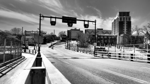 View of railroad tracks against cloudy sky
