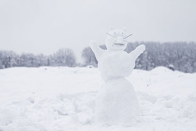 The figure of funny snowman animal in snowy field
