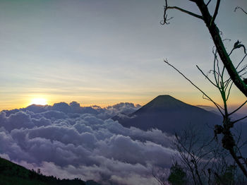 Scenic view of silhouette mountains against sky at sunset