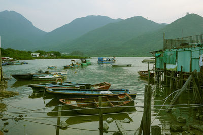 Boats moored at harbor