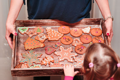 Close-up of girl looking at gingerbread cookies