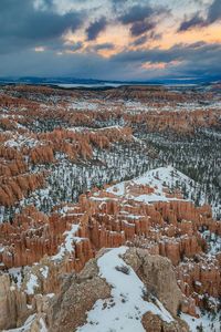 Snow covered landscape against sky