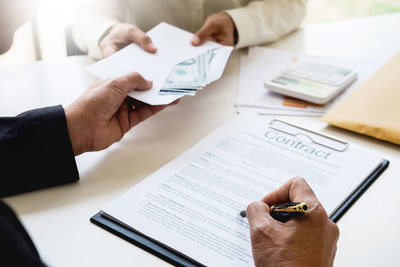 High angle view of man working on table