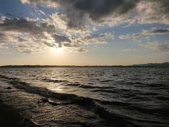 Scenic view of beach against sky during sunset