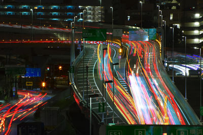 Low angle view of light trails at night