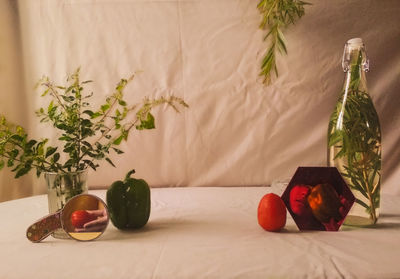Fruits on table against wall