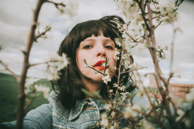 Portrait of woman against plants