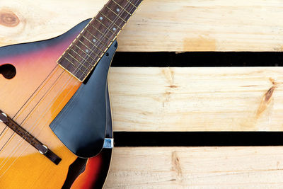 High angle view of guitar on table