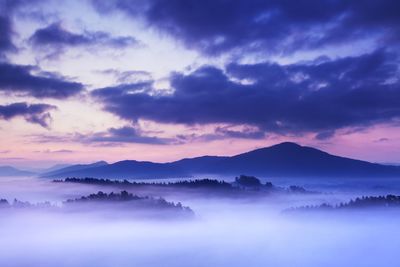 Scenic view of silhouette mountains against sky during sunset