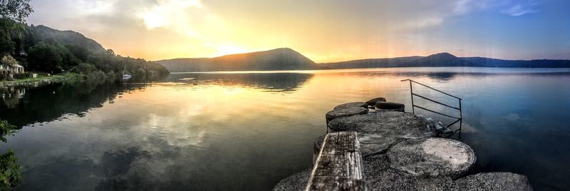 Scenic view of lake at sunset