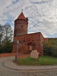 Exterior of historic building against sky