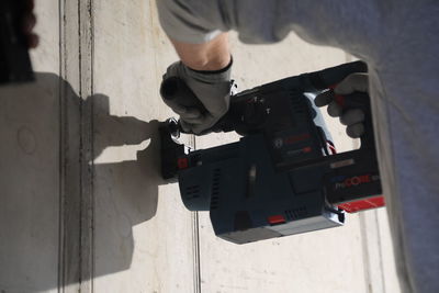 High angle view of man holding camera