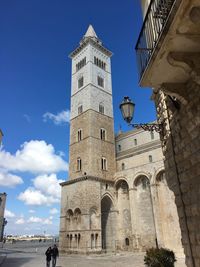 Low angle view of historical building against blue sky