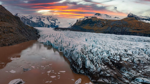 Beautiful glaciers flow through the mountains in iceland.