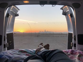 Low section of person relaxing in bus