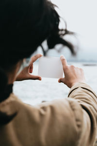 Side view of woman using mobile phone