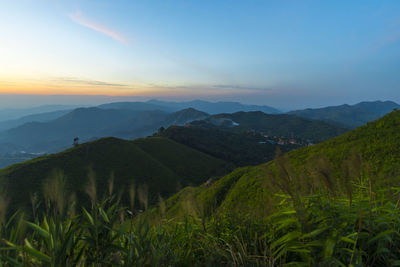 Scenic view of landscape against sky during sunset