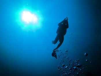 Low angle view of person swimming in sea