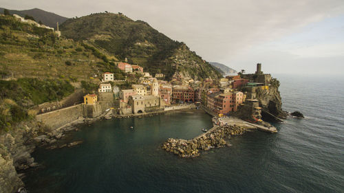 High angle view of buildings by sea