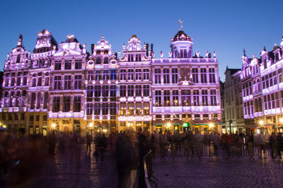 Reflection of buildings in city at night