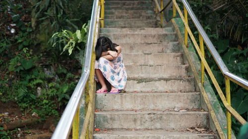 Full length of woman on staircase