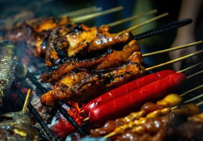 High angle view of meat on barbecue grill