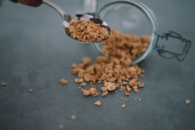 Close-up of crushed chestnuts and container on table