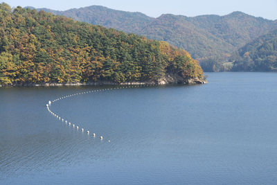 High angle view of lake by trees on mountain